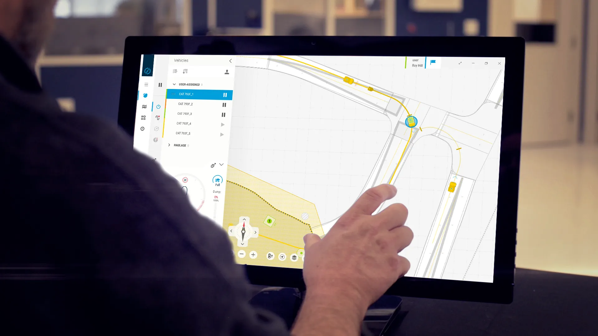 An engineer operating the Mobius fleet-orchestration interface on a touchscreen display