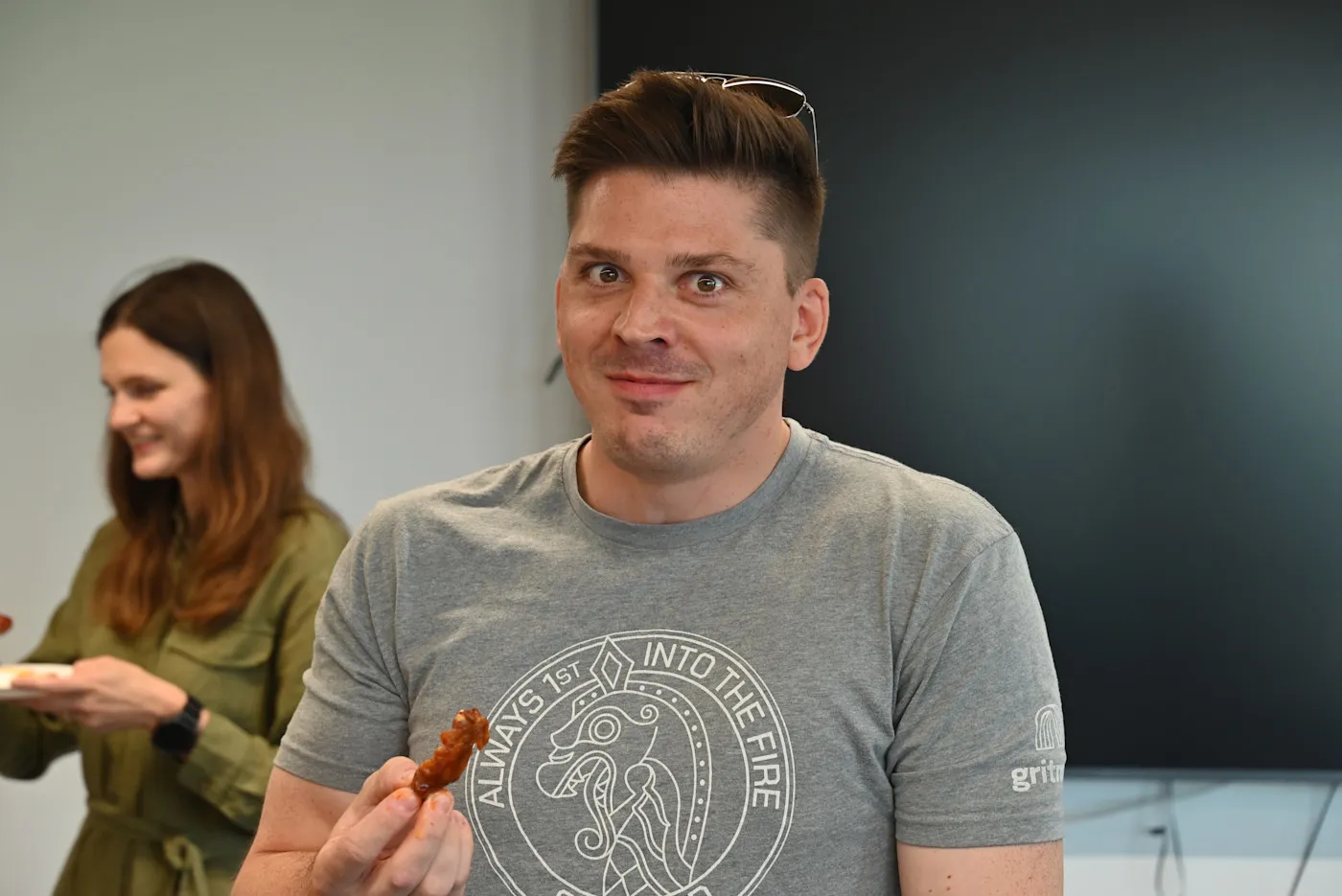 Gritmind team members reacting to hot wings at the Gritfest wing contest